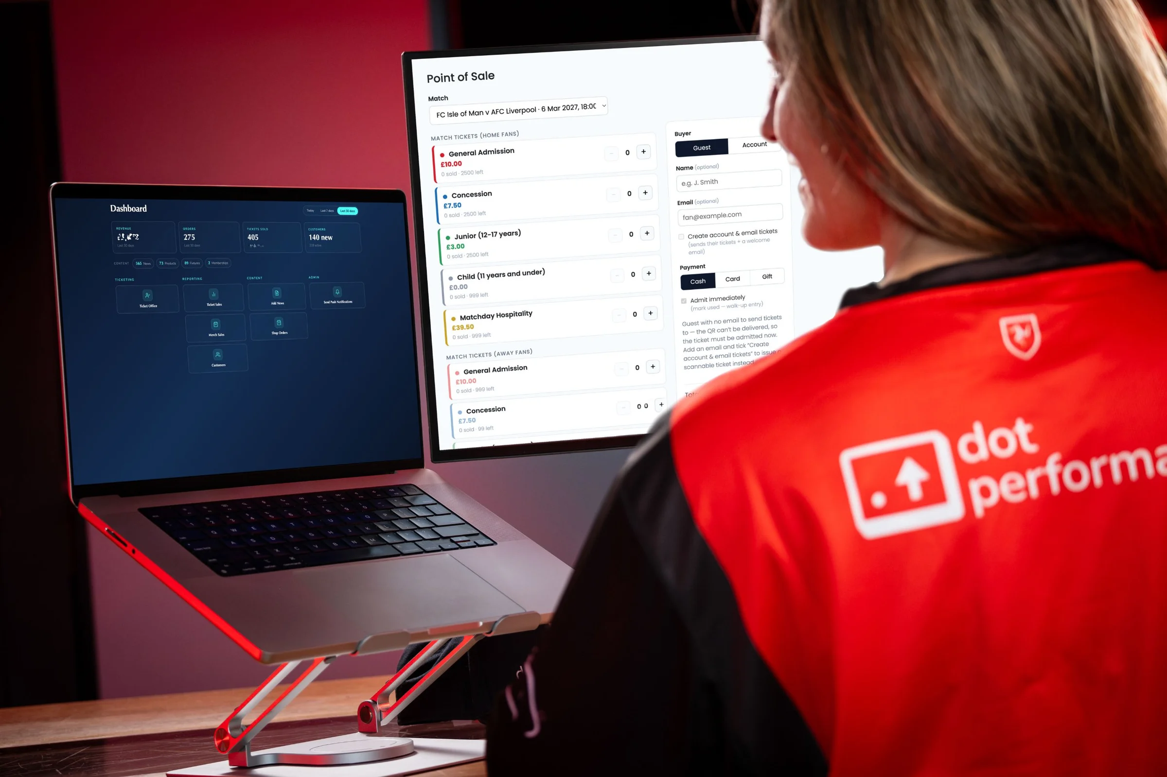 Rachel Fabrizio with the FC Isle of Man dashboard on a laptop and the point of sale on a monitor