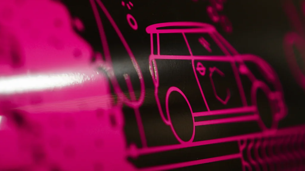 Close-up of the custom illustration of Manx life and island landmarks on the Mini’s wrap