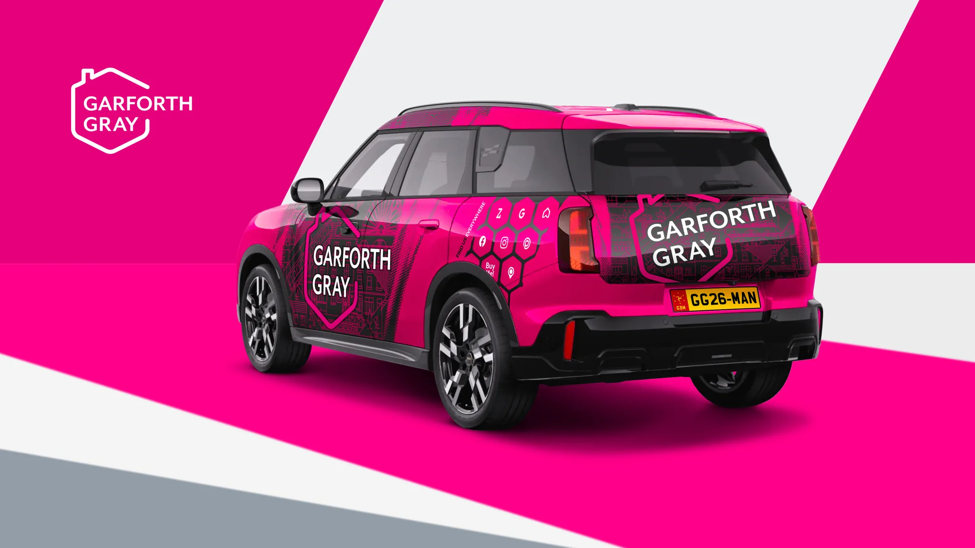 The rear of a Garforth Gray Mini, with the house mark on the tailgate and the portal and social icons on the rear quarter