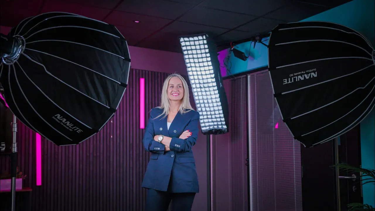 A member of Garforth Gray between Nanlite parabolic softbox lights.