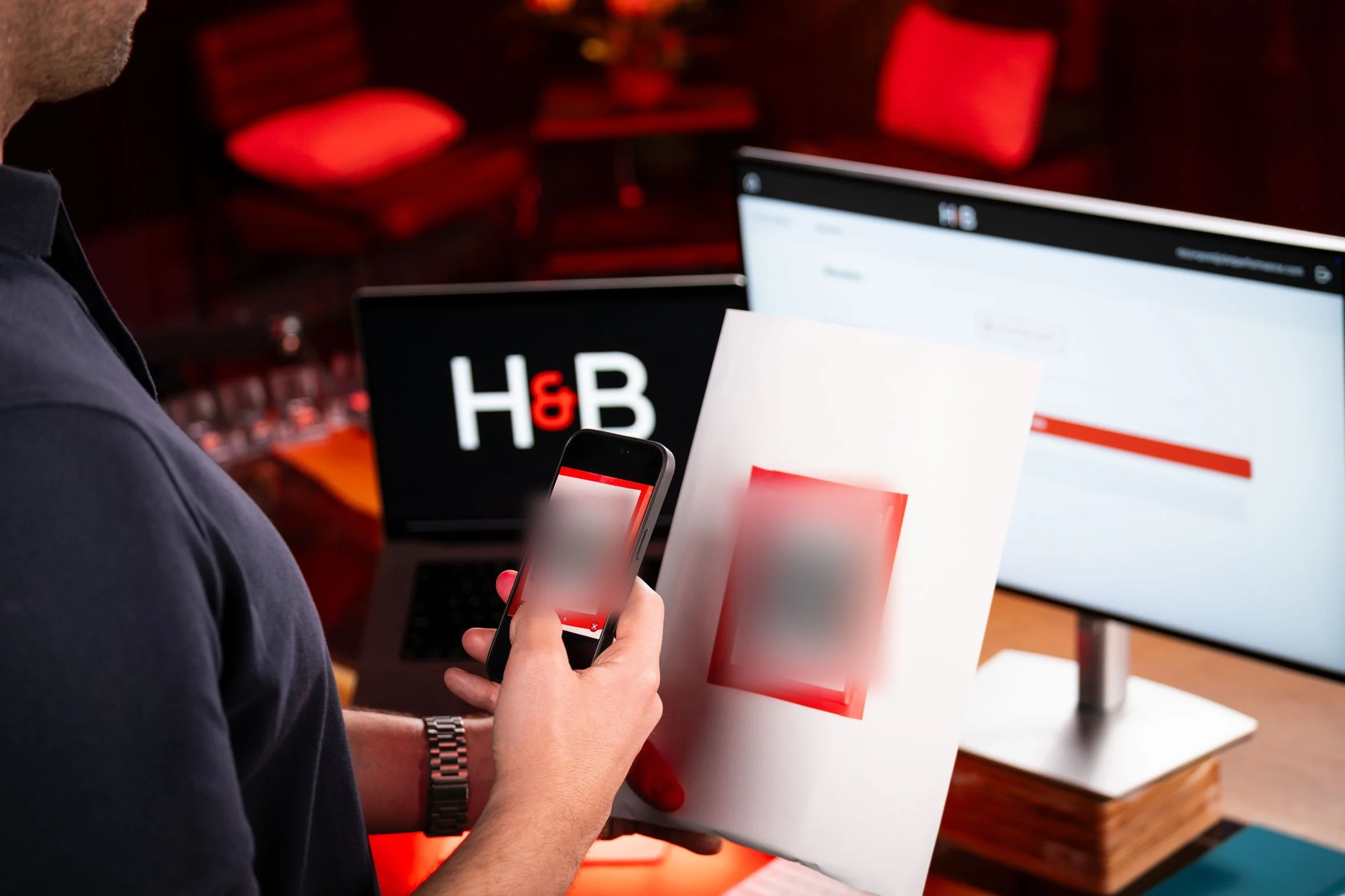 Scanning a QR code with the H&B app on a phone