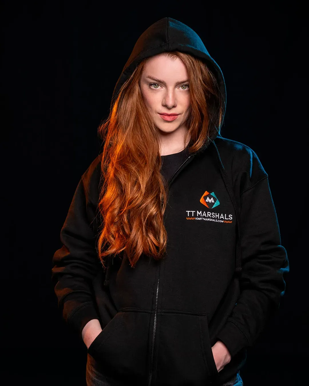 Ella Garvey with the hood up in the TT Marshals zipped hoodie